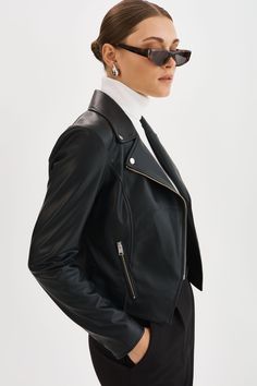 Exude confidence with the Monica Faux Leather Jacket, a true wardrobe essential for the modern woman. This classic piece features an asymmetric front zip closure, zipper pockets & notch collar. Versatile and effortlessly stylish, this jacket is perfect for both casual and formal occasions. Leather Jacket With Zipper Closure For Work, Chic Asymmetrical Outerwear For Business, Chic Asymmetrical Business Outerwear, Modern Leather Jacket With Asymmetrical Zip, Modern Outerwear With Zipper For Fall, Modern Leather Jacket With Asymmetrical Zip For Work, Modern Asymmetrical Zip Leather Jacket For Work, Sleek Leather Jacket With Zipper Closure, Sleek Long Sleeve Leather Jacket