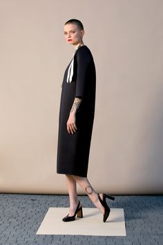 "With this beautiful Minimalist Dress we introduce our fashion for Spring 2019 ! This stylish black dress is cut in the the brand's most recognizable silhouette - the laid-back approach to elegance. The design has straight, elegant silhouette - it is our go-to for effortless, easy-to-wear pieces. Wear your occasion dress with sandals, high heels, ballerinas. ITEM DETAILS: - straight line - side pockets - shoulder bow decorations - custom orders: yes - color: black and creamy COMPOSITION AND CARE Office Shift Dress Knee-length, Knee-length Shift Dress For Office, Structured Knee-length Midi Dress For Cocktail, Elegant Structured Black Dress, Black Structured Midi Dress, Cocktail Dresses For Office Lady, Modern Black Cocktail Dress, Structured Knee-length Evening Dress, Structured Black Midi Dress