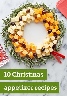 a christmas wreath made out of cheese and olives