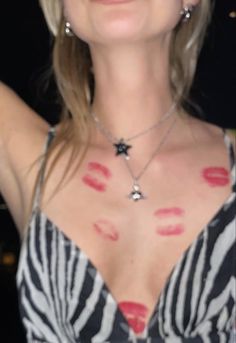 a woman with red lipstick on her chest