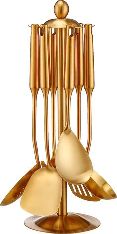 a golden sculpture with spoons and forks in it