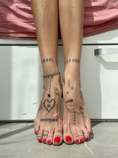 a woman's legs with tattoos on them and her feet in the shape of hearts