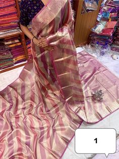 **Pure Dual Tone Tissue Silk Saree with Blouse Piece** Step into elegance with our Pure Dual Tone Tissue Silk Saree, a luxurious piece that radiates sophistication and timeless beauty. Perfect for festive occasions and special events, this handloom masterpiece is designed to make you feel like royalty. **Features - **Exquisite Craftsmanship Handloomed with precision, this saree showcases the impeccable skills of our artisans, ensuring a high-quality weave that's both durable and elegant. - **Dua Party Silk Saree With Handloom Details, Pink Dola Silk Blouse Piece For Celebration, Pink Dola Silk Blouse For Celebration, Celebration Pink Dola Silk Blouse Piece, Traditional Tissue Silk Wear With Zari Weaving For Party, Pink Dola Silk Saree For Celebration, Pink Tissue Silk Saree For Celebration, Pink Pre-draped Saree With Self Design For Celebration, Pink Pre-draped Saree For Celebration