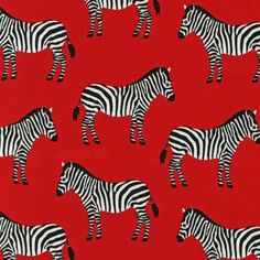 a red background with black and white zebras on the same color as each other