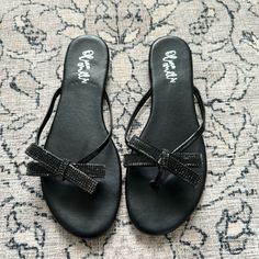 Black Olivia Miller Sandals With Rhinestone Bow. Size 10. Never Worn. Black Rhinestone Sandals With Round Toe, Black Rhinestone Round Toe Sandals, Black Embellished Toe Post Sandals, Bow Flip Flops, Double Strap Sandals, Olivia Miller, Suede Block Heels, Rhinestone Bow, Studded Sandals