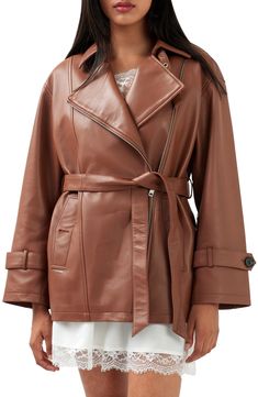 Add a sleek, chic touch to your look in this buttery jacket, cinched with a belt and made from glossy leather. 28 1/2" length Asymmetric front zip closure Notched lapels Side welt pockets Lined Leather Professional leather clean Imported Fashion Outerwear, Reversible Skirt, Sleek Chic, Real Leather Jacket, Brown Leather Jacket, Petite Tops, Biker Style, Welt Pockets, Vintage Look