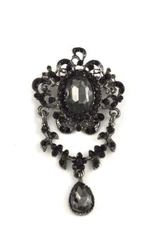 "This vintage styled brooch features delicate and intricate metal workings as well as dark acrylic stones for a gothic feel. This item has a standard brooch pin for easy and convenient application. This brooch is a perfect addition to any garment or accessory. Additionally, you can add this brooch to a gift box for a unique and memorable effect. Dimensions: Approx. 3.14\" x 1.75\" Visit our shop for more ideas! https://www.etsy.com/shop/OneStopTrims?ref=hdr_shop_menu" Gothic Brooch, Gothic Prom Dress, Dark Jewelry, Gothic Vampire, Dark Look, Rhinestone Brooches, Lace Collar, Gothic Jewelry, Vintage Stil