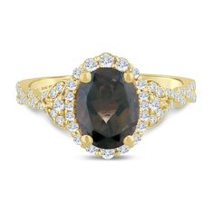 a brown and white diamond ring with two rows of diamonds around the band, set in yellow gold