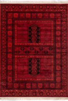 a red rug with black and white designs on it