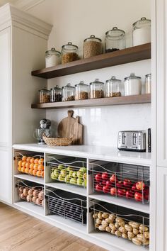 a kitchen with open shelving and lots of food