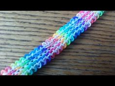 there is a rainbow crochet bracelet on the table