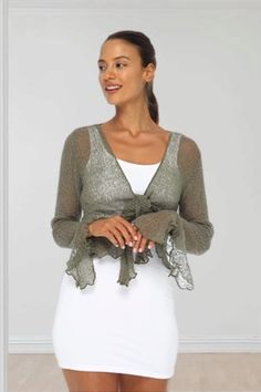 Sheer short cardigan has flattering naturally ruffled edges and long bell sleeves that add to the feminine silhouette; can be worn tied high, low or untied Long Bell Sleeves, Short Cardigan, Feminine Silhouette, Cropped Cardigan, Bell Sleeve, Women Crop, High Low, Bell Sleeves