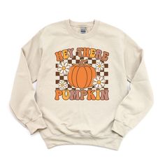 Looking for a cute versatile top to wear this summer? Make sure to grab one of our Hey There Pumpkin Flowers Sweatshirts! This soft and comfortable shirt is the perfect top for any outfit. It can be paired with biker shorts, Jeans, or the classic stay at home sweats! The bright color adds a pop of summer to any outfit. This sweatshirt is true-to-size, so be sure to order your regular size! If you are looking for a more oversized look, make sure to size up. Retro T-shirt For Everyday Fall Wear, Fall Slogan Tops For Leisure, Slogan Tops For Leisure In Fall, Comfortable Fit Tops For Leisure In Fall, Retro Everyday Fall Tops, Everyday Retro Fall Tops, Retro Everyday Tops For Fall, Retro Tops With Funny Print For Fall, Trendy Pre-shrunk Fall Sweatshirt