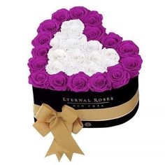 purple and white roses in a heart shaped box