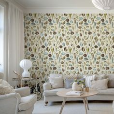 a living room filled with furniture and wallpaper