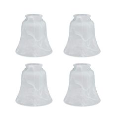 four white glass bells on a white background