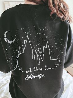 a woman wearing an all this time sweatshirt with the words always written in white on it