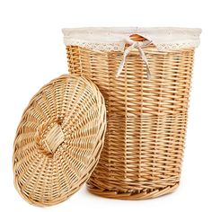 two wicker baskets sitting next to each other on a white background, one is empty and the other has a lid