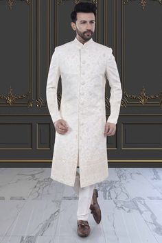 Embody classic elegance with our Mens Sherwani- U2-S379. Featuring delicate thread embroidery adorned with shimmering sequins, this Groom's sherwani exudes sophistication and luxury. Perfect for weddings and special occasions. Elevate your style and make a lasting impression. Festive Long Sleeve Sherwani For Reception, Formal Bandhgala With Chikankari Embroidery For Festive Season, Fitted Nehru Jacket With Naqshi For Transitional Season, Formal Fitted Nehru Jacket With Chikankari Embroidery, Traditional Wear With Zari Work For Winter Reception, Winter Bandhgala With Zari Work For Reception, Formal Bandhgala With Intricate Embroidery For Diwali, Winter Reception Bandhgala With Zari Work, Formal Nehru Jacket With Intricate Embroidery For Transitional Season