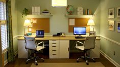 an office with two desks and computers on top of each other in front of a window