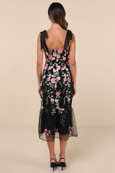 From casually chic cocktails to exceptional occasions, we can't get enough of the Lulus Stunning Inclination Black Embroidered Tie-Strap Midi Dress! Lightweight woven fabric shapes tying shoulder straps that support a mesh bodice with allover floral embroidery, a straight neckline, and flattering seaming. Fitted waist tops a figure-skimming trumpet skirt that features matching embroidery as it falls to a tiered midi hem. Hidden zipper/clasp at back. Fit: This garment fits true to size. Length: Mid-calf length. Size medium measures 42.50" from adjustable straps to hem. Bust: Works best for A to C cup sizes - consider sizing up for fuller bust. Waist: Fitted - very fitted at natural waist. Hip: Fitted - consider sizing up for fuller hips. Undergarments: May be worn with a strapless bra, adhe Floral Dress Wedding Guest, Matching Embroidery, Wedding Guest Dress Midi, Casually Chic, Fall Fashion Skirts, Embroidered Tie, Black Embroidered Dress, Trumpet Dress, Trumpet Skirt