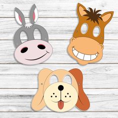 three paper masks with different animals on them