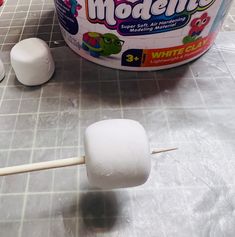 marshmallows are sitting on the counter next to an ice cream container