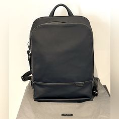 Original, New Condition Laptop Compartment Built In Usb-C Charging Port Designer Black Leather Rectangular Backpack, Designer Black Rectangular Leather Backpack, Designer Black Backpack For Formal Occasions, Classic Formal Backpack With Dust Bag, Black Business Backpack, Modern Black Backpack For Formal Use, Modern Black Backpack For Formal Occasions, Modern Black Formal Backpack, Tumi Bags