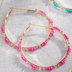 Bring a pop of fun and color into your outfit with these resort earrings! The hoops are gold in color and feature gold and colored beads. Available in Hot Pink and Teal Hot Pink And Teal, Your Outfit, In Hot, Hot Pink, Fashion Jewelry, Beads, Pink, Gold, Color