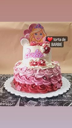 there is a cake with barbie on it