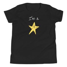 Your kid is a star and they should show it!  Let them shine and show their style with this awesome tee! It's light, soft, and comes with a unique design that stands out from the crowd wherever you go! * 100% combed and ring-spun cotton * Heather colors are 52% combed and ring-spun cotton, 48% polyester * Athletic Heather is 90% combed and ring-spun cotton, 10% polyester * Fabric weight: 4.2 oz/yd² (142 g/m2) * Pre-shrunk fabric * 32 singles * Relaxed unisex fit * Side-seamed construction * Blank Star T Shirt, Star Top, Cool Tees, Kids Tops, Fabric Weights, Spun Cotton, Polyester Fabric, Unique Designs, Kids Outfits