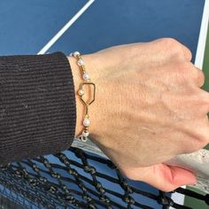 This two tone beaded pickleball pearl bracelet is the perfect way to express your love for pickleball. Made with high-quality materials that won't tarnish or break, these bracelets come in many styles and colors, so you can find the one that's perfect for any occasion. Show off your love for pickleball with a beautiful, unique bracelet that will embellish any outfit and make you stand out! Get ready to show off your style and passion for pickleball with a unique bracelet! HIGH-QUALITY MATERIALS- Adjustable Sporty Bracelet For Everyday, Sporty Adjustable Customizable Bracelets, Pickleball Bracelet, Customizable Adjustable Sports Bracelet, Adjustable Gold-plated Tennis Bracelet, Tennis Jewelry, Bracelet Keychains, Mens Keychains, Unique Bracelets