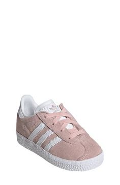 Initially designed in '91 as a training shoe for top athletes, the iconic Gazelle sneaker has been refreshed with stretchy laces for your little athlete. Pull-on style with elastic laces Leather and synthetic upper/textile lining/rubber sole Imported Unisex Shoes Sneakers, Adidas Kids, Elastic Laces, Training Shoes, 8 M, Big Kids, Pink White, Rubber Sole, Nordstrom