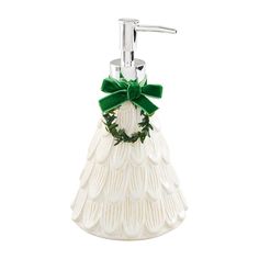 a white ceramic soap dispenser with a green bow on the front and bottom