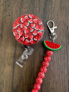 a watermelon themed retractable id badge attached to a lanyard