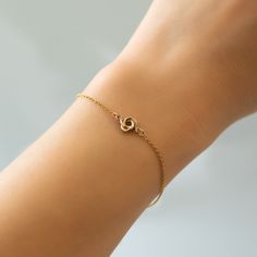 This dainty Love knot bracelet is the perfect friendship gift or gift for her. Gold Filled Love Knot Diameter 1/4in (6mm) Chain Length: 6-7.5in (15-19cm) Lobster Clasp Handcrafted in NYC Hypoallergenic, lead and nickel free #B312-GF Delicate Adjustable Gold Bracelet For Gift, Delicate Hypoallergenic Jewelry For Friendship, Dainty Rose Gold Name Bracelet For Friendship, Elegant Rose Gold Heart Bracelet For Friendship, Simple Adjustable Gold Bracelet For Gifts, Dainty Adjustable Heart Bracelet For Promise, Dainty Infinity Bracelets With Adjustable Chain, Dainty Infinity Bracelet With Adjustable Chain, Dainty Infinity Bracelet For Everyday Wear