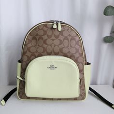 New Coach Court Backpack In Signature Canvas Khaki/ Pale Lime 5671 $450 Signature Coated Canvas And Refined Pebble Leather Inside Zip And Multifunction Pockets Double Zip Closure, Fabric Lining Handle With 2 1/4" Drop Outside Zip Pocket Adjustable Shoulder Straps 10 3/4" (L) X 12 1/2" (H) X 4 3/4" (W) Style No. 5671 Coach Fannypack, Slim Backpack, Packable Backpack, Coach Backpack, Big Handbags, Monogram Backpack, Daypack Backpack, Denim Backpack, Day Backpacks