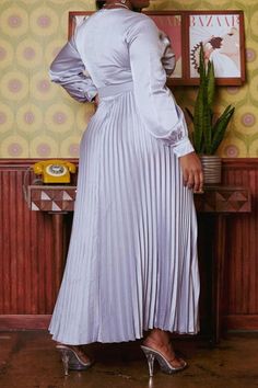 Effortless plus size women's pleated maxi dress in fit to flare design, v neck style, waist belt and long sleeves with buttoned wrist cuffs.(100% POLYESTER) NO STRETCH Model Info: Height: 5'10" Bust: 42" Waist: 37" Hip: 54" 1XL Silver Maxi Dress, Split Maxi Dress, Pleated Maxi Dress, Pleated Maxi, Satin Mini Dress, Wrist Cuffs, Silver Dress, Long Sleeve Midi, Long Sleeve Midi Dress