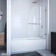 a bathroom with a white tiled wall and bathtub