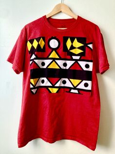 African print mens tshirt  Samakaka print appliqueed onto front Red Graphic Print T-shirt, Red Graphic Design Crew Neck T-shirt, Red Graphic Crew Neck T-shirt, Red Crew Neck T-shirt With Graphic Design, Red Relaxed Fit T-shirt With Graphic Design, Unisex Red Cotton T-shirt, Cotton Graphic Tee With Print, Unisex Printed Crew Neck T-shirt, Unisex Crew Neck Printed T-shirt