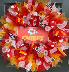 the chiefs wreath is decorated with red, yellow and white mesh ribbons that match the team's uniform