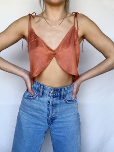 Our Tara top has a flattering split detail with adjustable tie up straps! Perfect for summer! 55% Cotton, 45% Polyester Model is wearing a size Small (Height: 5'3, Waist: 25, Hips: 32, Bust: 32A) Top Satin, Crop Top En Satin, Easy Sew Crop Top, Diy Satin Top, Silk Tops, Crop Top Diy, Silk Top Outfit, Crop Top Satin, Unique Sewing Patterns