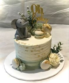 a white cake with an elephant on top