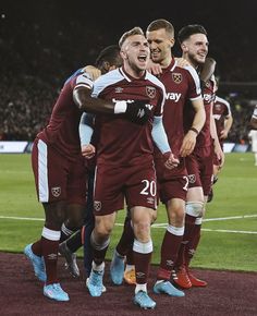 the soccer players are celebrating on the field