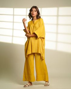 Introducing our Linen Oversized Loungewear Set - the epitome of cozy elegance for your fall wardrobe! Embrace comfort and style with this delightful ensemble featuring a loose half sleeves top and matching long pants. Crafted from the luxurious Viscose linen, this set effortlessly combines warmth and breathability for the perfect companion. Specifications: Length Top: 32 inches, Pant length: 39.5 inches Quality: Premium Linen Care: Hand wash with a touch of love or spoil it with a gentle dry clean. Ships within 3-5 working days. Need it sooner? Drop us a message for expedited delivery options. Additional Features: Colour: Dive into Jaisalmer Mustard or customize it to your heart's desire! Feel: Immerse yourself in softness and lightness. Availability: Made to order, exclusively for you. Fa Yellow Relaxed Fit Loungewear Sets, Yellow Relaxed Fit Lounge Sets, Linen Tunic For Loungewear, Oversized Tunic For Loungewear, Oversized Lagenlook Tunic For Loungewear, Relaxed Linen Tunic For Loungewear, Relaxed Fit Linen Tunic For Loungewear, Oversized Linen Tunic For Loungewear, Oversized Loungewear