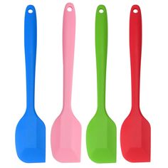 three different colored spoons with handles on each side, one in the middle and one in the back