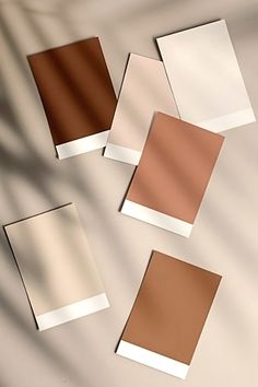 four different shades of brown and white