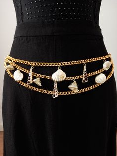 "Awesome UNUSED vintage gold chain belt with seashells charms, from a 90s NEW OLD STOCK. The sheashells have 24K gold trims. The chain is made of aluminium with a good quality gold tone plate. It's wearable as a belly chain or waist chain belt, as the closure is adjustable and will fit for several sizes. The design is beautiful and elegant with 3 chains in the front and 1 chain surrounding waist or hips, which drops on the side, ending with a seashell. IMPORTANT: I recommend you check the measur Tone Belly, Vintage Gold Chain, Waist Chain Belt, Gold Locket Necklace, Mermaid Outfit, Heart Locket Necklace, Beaded Belt