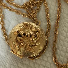 Vintage Gold Tone Locket. Dimensional Flowers Open to the Inside of Locket. Perfume or Picture Locket Pendent on Gold Tone Chain.  This locket is in good shape for its age.  Size: Round Locket Open to Inside: 1 1/8" X 1 1/4", Chain: 23" For other jewelry and vintage items see: www.VeryVictorianStudio.etsy.com. For sewing related items see my other shop: www.SewingRoomStore.etsy.com. Thank you for looking! Luxury Vintage Locket Necklaces, Cheap Vintage Gold Locket Necklace, Gold Pendent, Gold Locket Necklace, Picture Locket, Round Locket, Vintage Lockets, Gold Locket, Locket Necklace