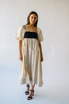 Get ready to slay in the Ambreen Puff Sleeve Maxi Dress! This unique dress features trendy puff sleeves and a flattering maxi length. The beige color adds a touch of sophistication, making it perfect for any special occasion. Stand out in style with this playful and chic dress! Details self: 100% cotton lining: 100% polyester Fabric Care Guide Here Sizing & Fit Measurements are approximate and taken while laying flat across the front. Not doubled. x-small: bust = 15"; length = 45" small: bust = Spring Beige Maxi Dress With Square Neck, Beige Maxi Dress With Square Neck For Spring, Chic Cream Maxi Dress With Short Sleeves, Chic Beige Empire Waist Dress, Summer Cream Dress With Balloon Sleeves, Chic Beige Maxi Dress With Square Neck, Summer Cream Balloon Sleeve Dress, Chic Maxi Length Puff Sleeve Dress With Gathered Sleeves, Chic Maxi Puff Sleeve Dress With Gathered Sleeves